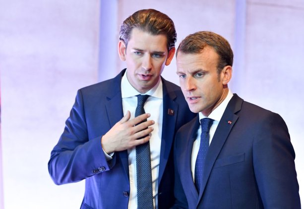 Austria's Chancellor Sebastian Kurz (L) and France's President Emmanuel Macron confer prior to the start of a plenary session at the Mozarteum University during the EU Informal Summit of Heads of State or Government in Salzburg, Austria, on September 20, 2018. - (Photo by JOE KLAMAR / AFP) (Photo credit should read JOE KLAMAR/AFP/Getty Images)