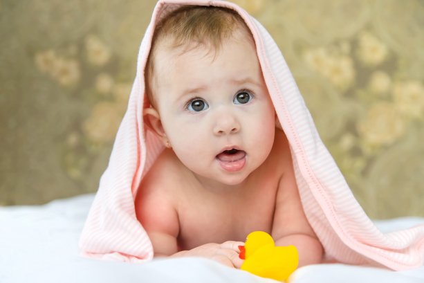 Baby after bathing in a towel. Selective focus. Child.